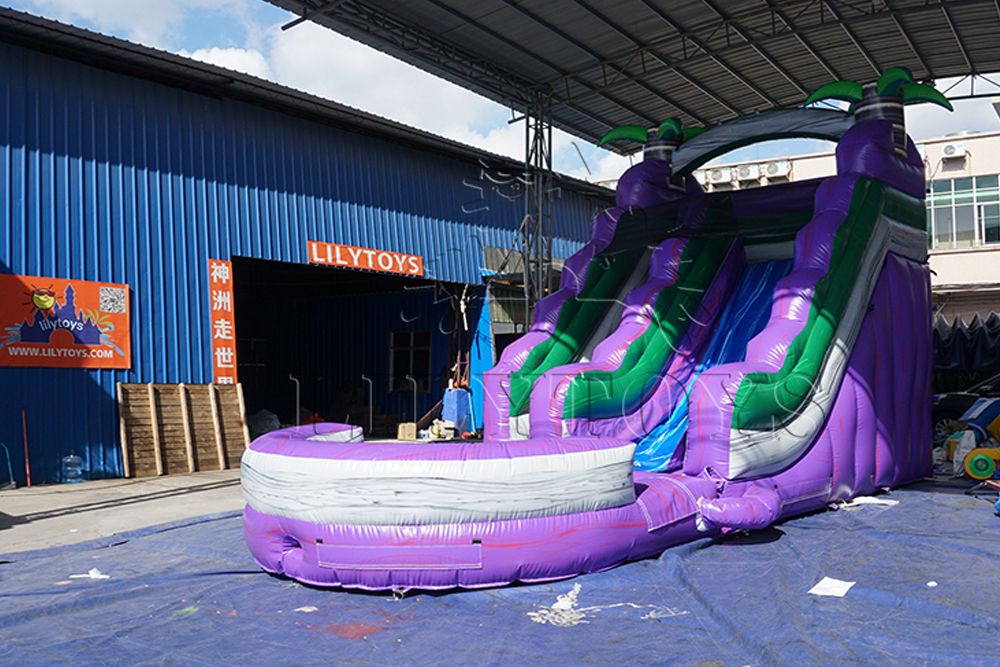 purple inflatable water slide with big pool