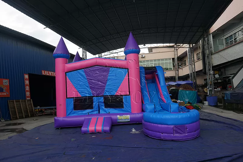 Pink inflatable bounce castle with slide