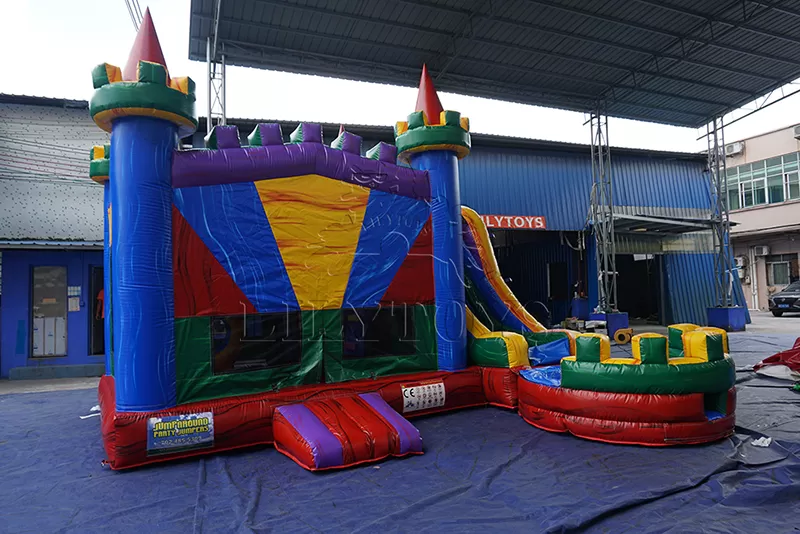 rainbow inflatable castle with slide