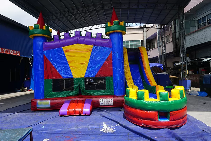 rainbow inflatable castle with slide