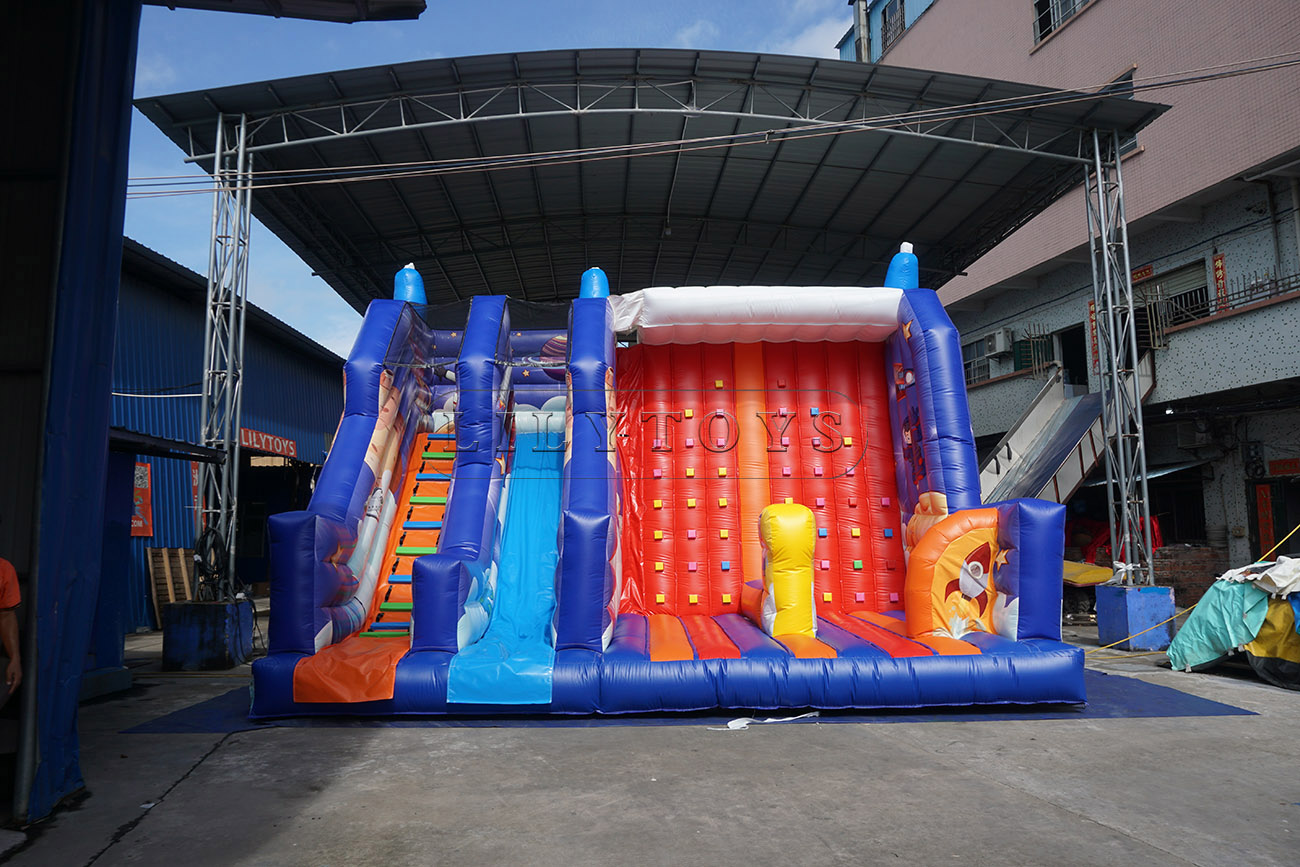 Inflatable dry slide with rock climbing