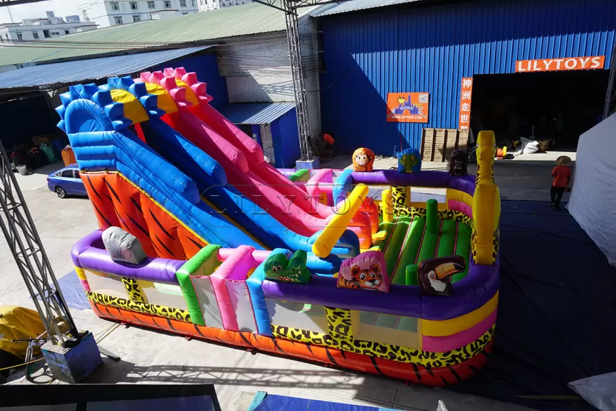 Animal inflatable multicolored amusement park with slide