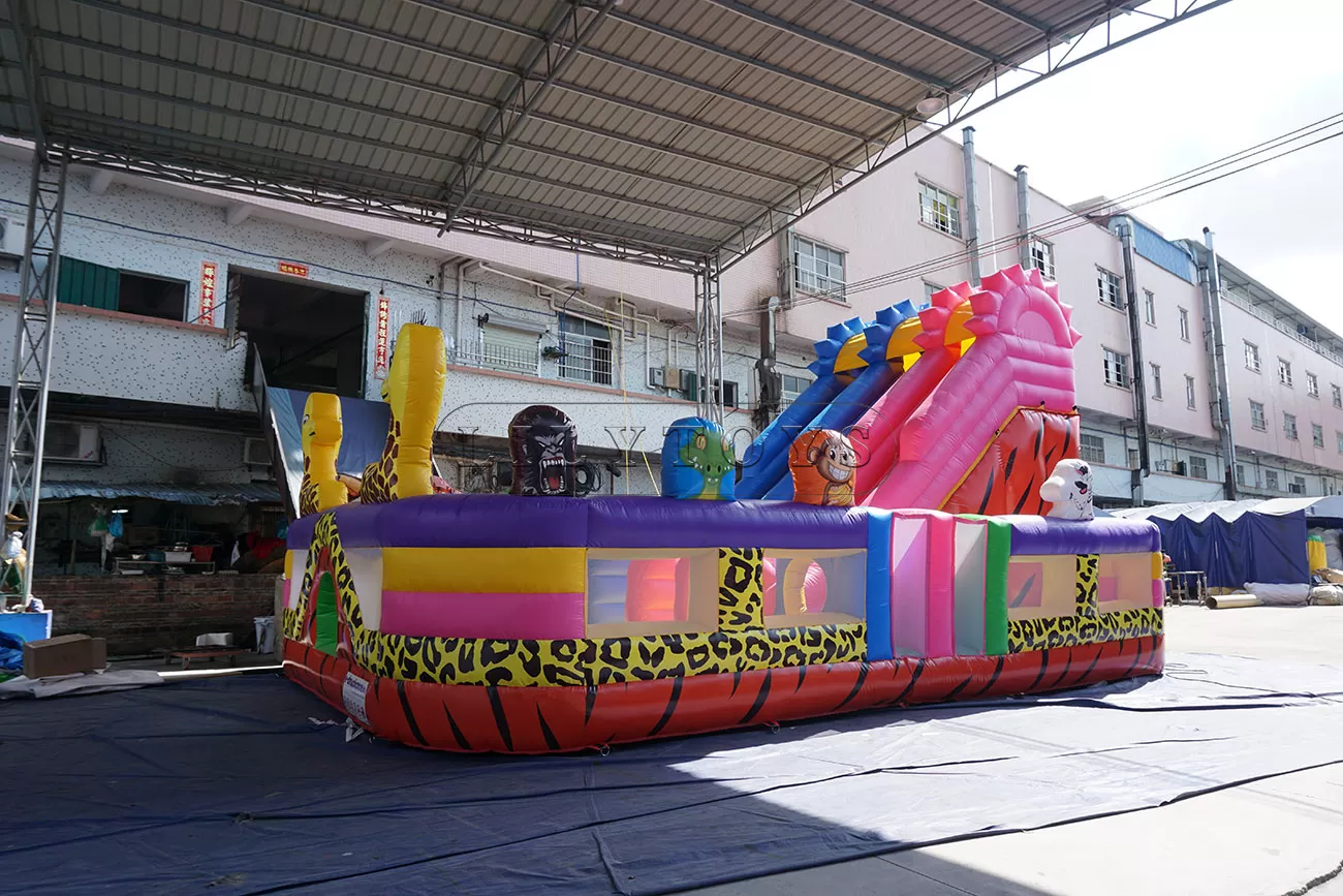 Animal inflatable multicolored amusement park with slide