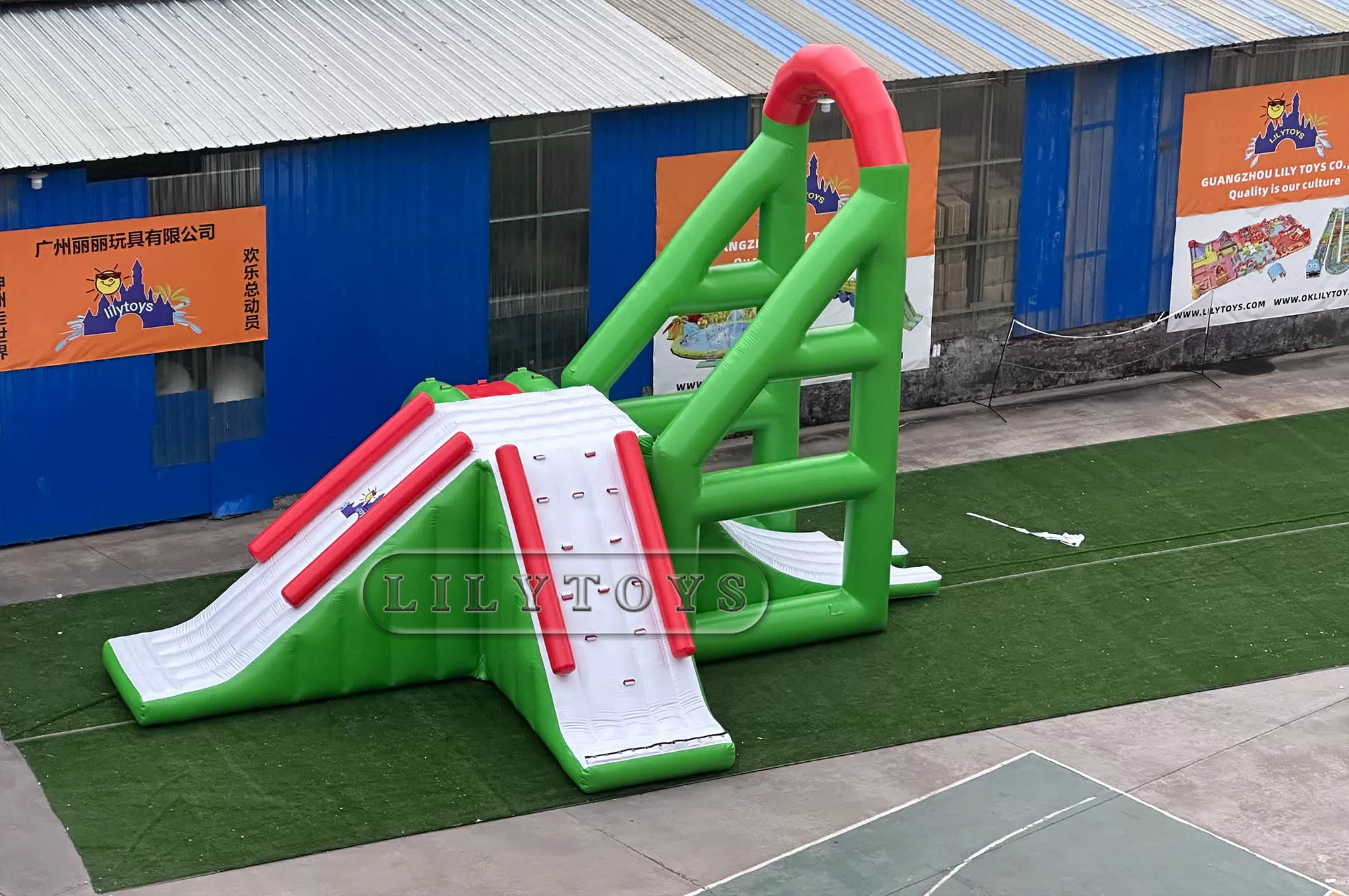 green inflatable water park water tower with swing