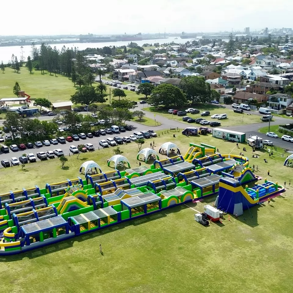 green and blue inflatable blue obstacle course park