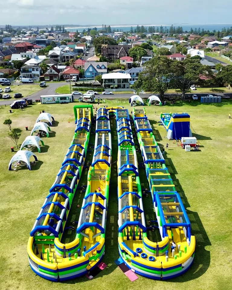 green and blue inflatable blue obstacle course park
