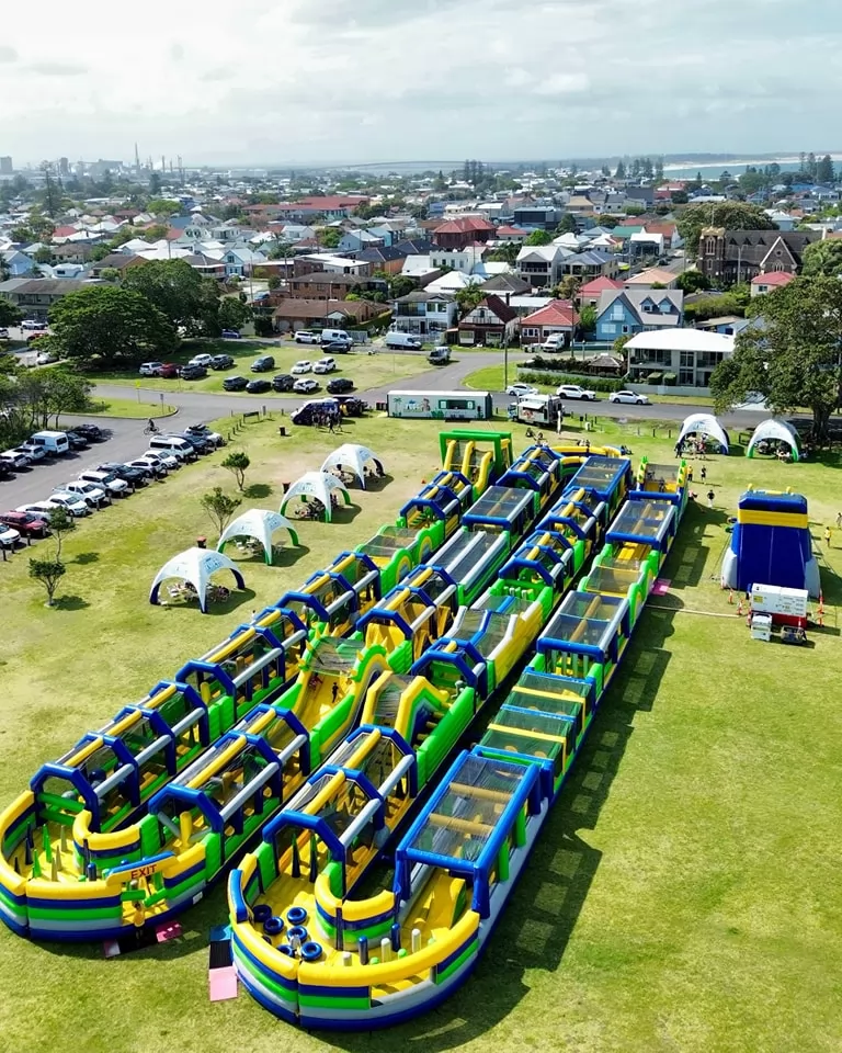 green and blue inflatable blue obstacle course park